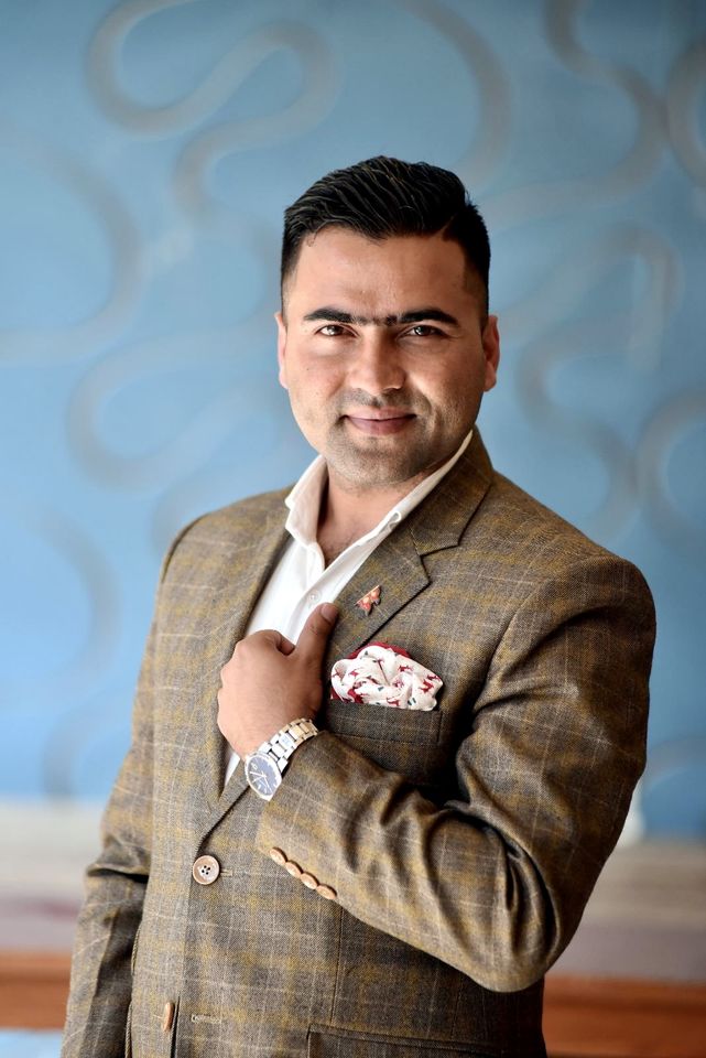 In a check blazer