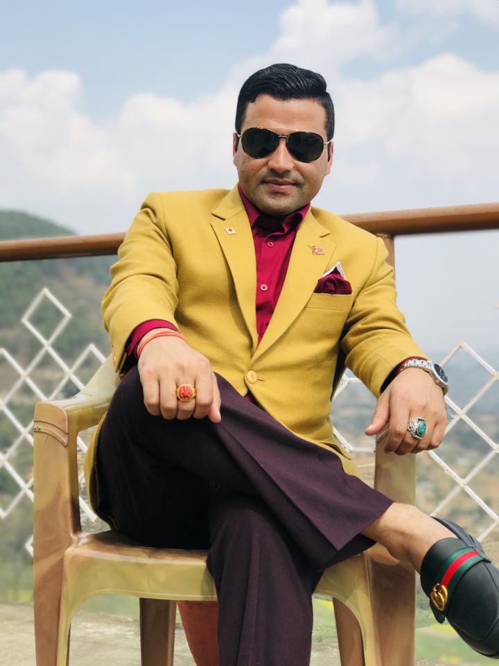 In a mustard blazer